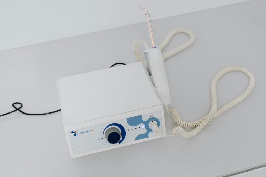 A close-up view of dental machinery on a white table used in modern dentistry.
